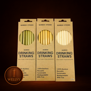 Three packages of bamboo drinking straws with visible branding on a dark background