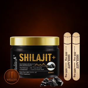 Shilajit product with gold lid and wooden sticks on a dark background